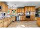 A kitchen sink is set beneath a window that floods the space with natural light at 30717 Conifer Mountain Dr, Conifer, CO 80433