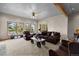 Comfortable living room featuring plush seating, large windows, and a unique coffee table design at 30717 Conifer Mountain Dr, Conifer, CO 80433