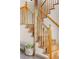 Elegant wooden staircase with natural wood railings and a cozy seating nook at 30717 Conifer Mountain Dr, Conifer, CO 80433