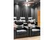 Home theater featuring comfortable seating, and elevated surfaces for snacks and drinks at 30717 Conifer Mountain Dr, Conifer, CO 80433