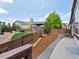 A fenced backyard with a gravel walking path, grass, and mulch at 1907 Windemere Ln, Erie, CO 80516