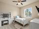 Bright bedroom features a ceiling fan, carpet, and a white furniture set with plenty of storage at 1907 Windemere Ln, Erie, CO 80516