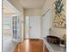 Inviting entryway with hardwood floors, ample natural light, and a stylish console table at 1907 Windemere Ln, Erie, CO 80516