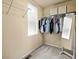 Walk-in closet with neutral carpet, metal rack, and window for ample storage and organization at 1907 Windemere Ln, Erie, CO 80516