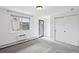 Clean bedroom view featuring neutral walls, a window for natural light, closet space, and clean flooring at 1 N Pearl St # 102, Denver, CO 80203