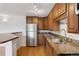 Kitchen features stainless steel appliances, granite countertops and hardwood floors at 1 N Pearl St # 102, Denver, CO 80203