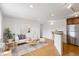 Bright living room featuring modern decor, hardwood floors, and stainless steel appliances at 1 N Pearl St # 102, Denver, CO 80203