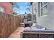 Cozy backyard retreat with a comfortable outdoor sofa, patio lights, and stone paving for a relaxing ambiance at 553 S Sherman St, Denver, CO 80209
