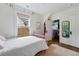 Cozy bedroom with a closet, hardwood floors, and a bright window, providing a tranquil and organized space at 553 S Sherman St, Denver, CO 80209
