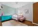 Bright and charming bedroom with a playful color scheme, hardwood floors, and natural light, offering a cozy atmosphere at 553 S Sherman St, Denver, CO 80209