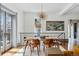 Bright dining room featuring a modern chandelier, decorative painting, and lots of natural light at 553 S Sherman St, Denver, CO 80209
