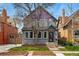 Charming two-story home with a well-maintained lawn, beautiful front yard, and welcoming entrance at 553 S Sherman St, Denver, CO 80209