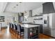 Modern kitchen with stainless steel appliances, granite countertops, and a stylish island with bar seating at 553 S Sherman St, Denver, CO 80209