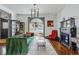 Cozy living room featuring a fireplace, hardwood floors, and large windows offering lots of natural light at 553 S Sherman St, Denver, CO 80209