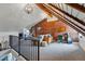 Cozy loft living room featuring exposed brick, vaulted ceilings, and comfortable seating, creating a unique and inviting space at 553 S Sherman St, Denver, CO 80209
