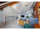 Comfortable loft living room featuring exposed brick, vaulted ceilings, and cozy seating, creating a relaxing atmosphere at 553 S Sherman St, Denver, CO 80209