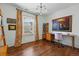 Bright office space with hardwood floors, a large window, and a stylish desk setup, perfect for remote work or study at 553 S Sherman St, Denver, CO 80209