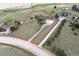 Aerial view of the property with a spacious lot, long driveway, and outbuildings at 2146 Savage Rd, Elizabeth, CO 80107