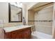 Cozy bathroom features a vanity with marble countertop and tiled shower at 2146 Savage Rd, Elizabeth, CO 80107