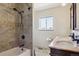 Updated bathroom features a tiled shower, double sinks and modern fixtures at 2146 Savage Rd, Elizabeth, CO 80107