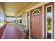 Charming covered front porch featuring stone accents and a stylish front door at 2146 Savage Rd, Elizabeth, CO 80107
