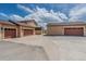 Spacious garage and workshop with multiple doors and a concrete driveway at 2146 Savage Rd, Elizabeth, CO 80107