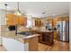 Spacious kitchen featuring custom cabinetry, granite counters, and stainless steel appliances at 2146 Savage Rd, Elizabeth, CO 80107