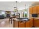 Bright, open kitchen with stainless steel appliances, granite countertops, and a breakfast nook at 2146 Savage Rd, Elizabeth, CO 80107