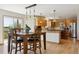 Bright kitchen with wooden cabinets, granite countertops, and stainless steel appliances at 2146 Savage Rd, Elizabeth, CO 80107