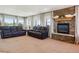 Comfortable living room with a cozy fireplace and lots of natural light at 2146 Savage Rd, Elizabeth, CO 80107