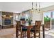 Cozy living area with a stone fireplace, natural light, and wood floors at 2146 Savage Rd, Elizabeth, CO 80107
