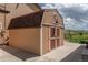 Outdoor shed with double doors providing additional storage at 2146 Savage Rd, Elizabeth, CO 80107