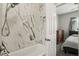 Bathroom featuring a shower with marble tile and bronze fixtures at 8199 Welby Rd # 1903, Denver, CO 80229