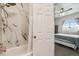 Bathroom featuring a shower with marble tile at 8199 Welby Rd # 1903, Denver, CO 80229