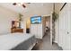 Bedroom featuring a TV on the wall and neutral colored walls at 8199 Welby Rd # 1903, Denver, CO 80229