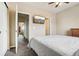 Neutral toned bedroom with a TV on the wall and carpeted floors at 8199 Welby Rd # 1903, Denver, CO 80229