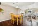 Charming dining area adjacent to the living room, perfect for Gathering meals and entertaining at 8199 Welby Rd # 1903, Denver, CO 80229