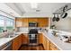 Functional kitchen with modern appliances, ample counter space, and wood cabinetry at 8199 Welby Rd # 1903, Denver, CO 80229