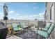 Inviting patio offers a serene outdoor space with comfortable seating and views of blue skies at 8199 Welby Rd # 1903, Denver, CO 80229