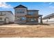 New home with a covered back porch and large backyard space at 24563 E 34Th Ave, Aurora, CO 80019
