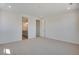 This bathroom features neutral carpet and a vanity with double sinks and plenty of light at 24563 E 34Th Ave, Aurora, CO 80019