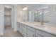 Bathroom features double sinks and a large mirror with a view to the walk-in shower at 24563 E 34Th Ave, Aurora, CO 80019