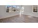 This bedroom features new wood flooring and large windows for lots of light at 24563 E 34Th Ave, Aurora, CO 80019
