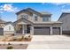 Charming two-story home with a three car garage and beautiful stone accents at 24563 E 34Th Ave, Aurora, CO 80019