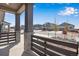 Covered front porch featuring brick pillars and view of the neighborhood at 24563 E 34Th Ave, Aurora, CO 80019