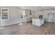 This kitchen features stainless steel appliances, a large island, shaker cabinets and eat in area at 24563 E 34Th Ave, Aurora, CO 80019