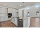 Kitchen boasts stainless appliances, stone countertops and a large island with sink at 24563 E 34Th Ave, Aurora, CO 80019