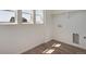 Bright laundry room featuring washer/dryer hookups, vinyl flooring, and natural light at 24563 E 34Th Ave, Aurora, CO 80019