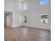 A bright living room with tall ceilings and many windows provides natural light at 24563 E 34Th Ave, Aurora, CO 80019