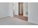 Spacious living room with neutral carpet and views into other rooms in the house at 24563 E 34Th Ave, Aurora, CO 80019